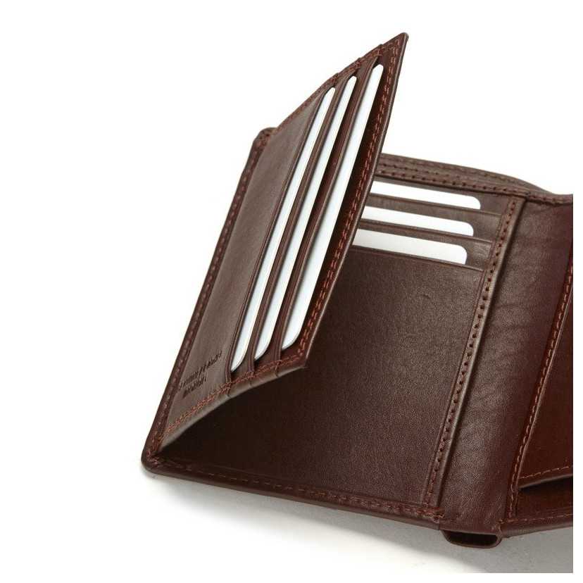 Wallet with clasp and coin pocket in brown leather, close-up of slots, on a white background - MONPIEL