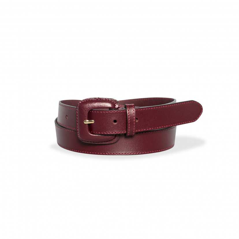 Women’s burgundy leather belt with covered buckle, rolled up, on a white background - MONPIEL