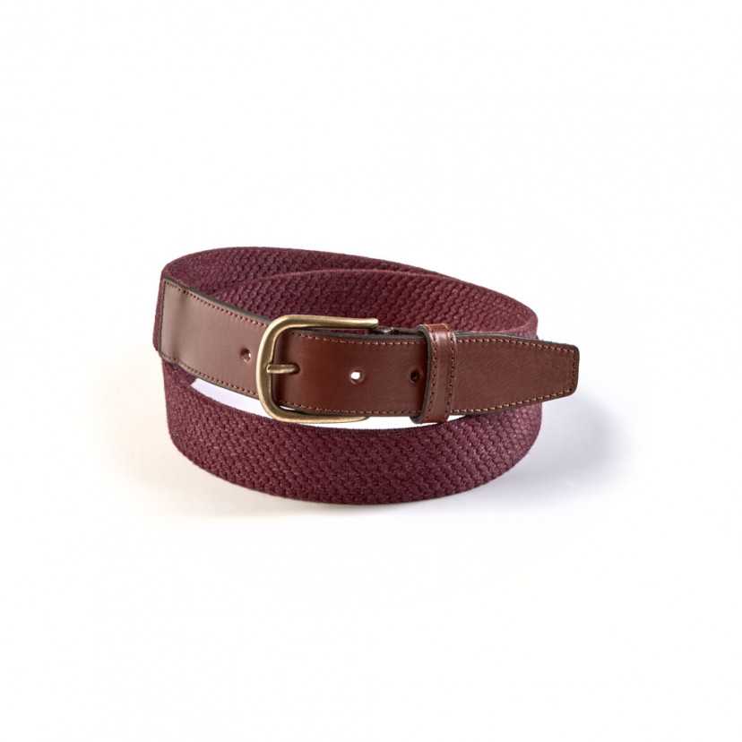 Men’s burgundy elastic leather belt, coiled, on a white background - MONPIEL