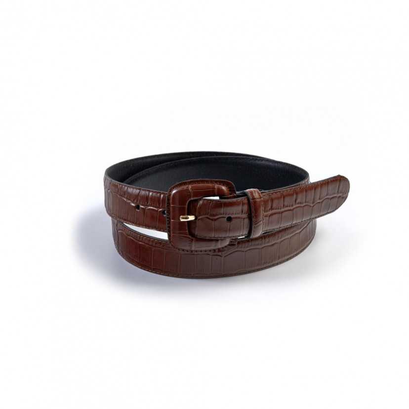 Women’s brown belt with crocodile-patterned covered buckle, coiled, on a white background - MONPIEL