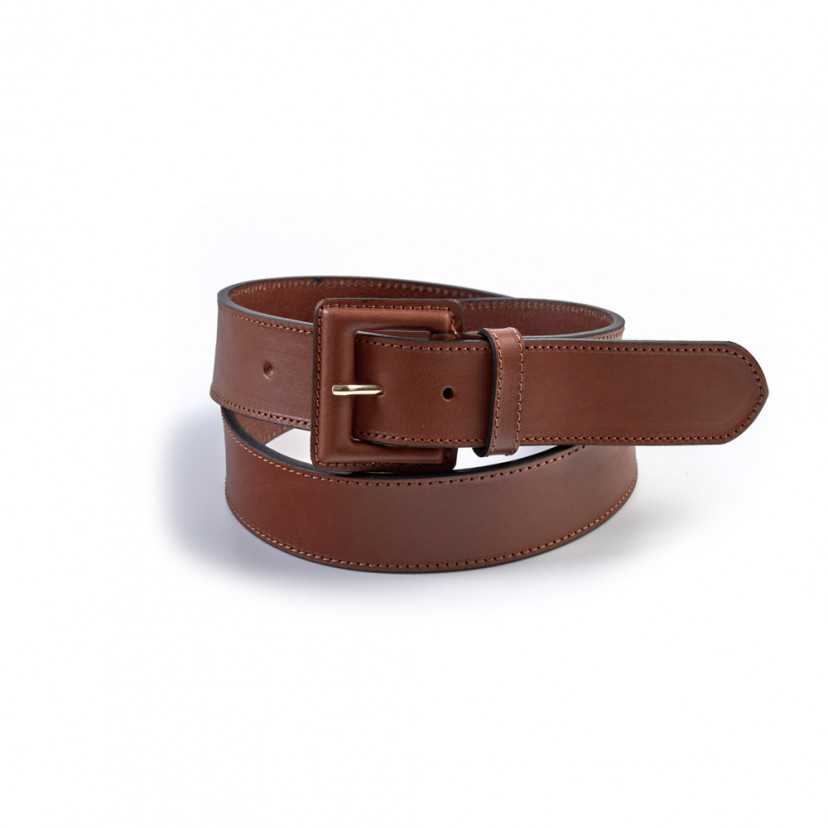 Women’s wide leather belt with a covered buckle, coiled, in tan, on a white background - MONPIEL