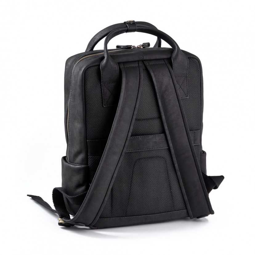 Black leather backpack, rear and slightly side view, on a white background, showing shoulder straps - MONPIEL