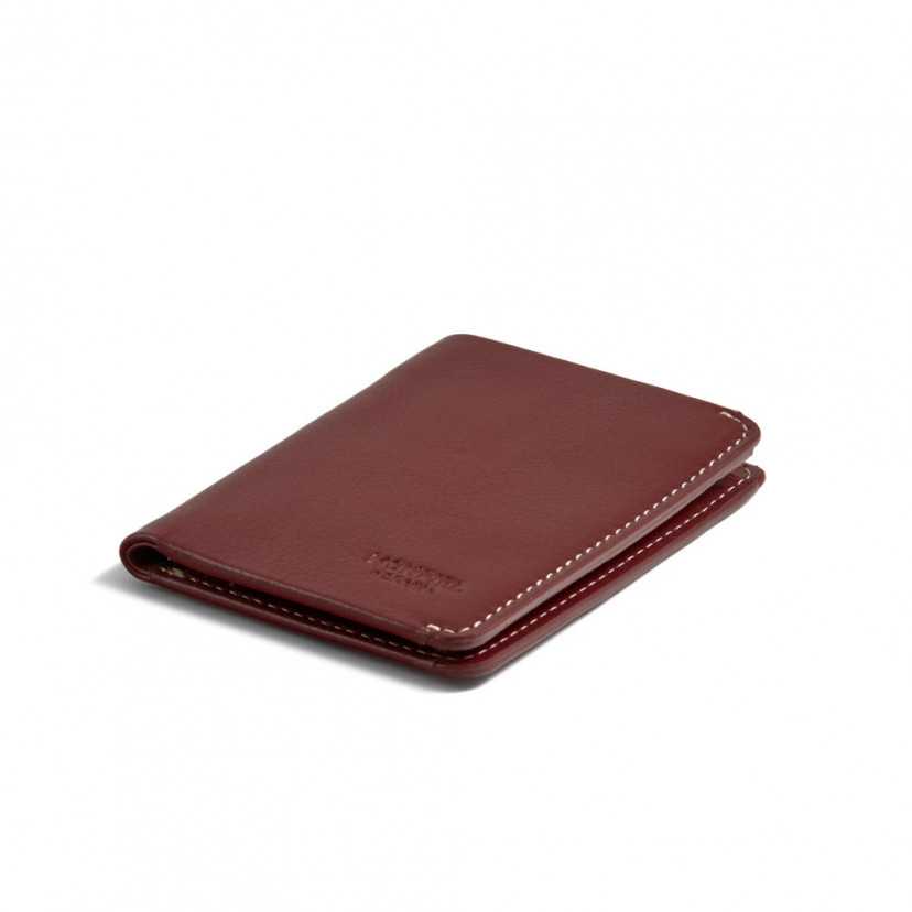 Small men's leather wallet in burgundy, perspective view on a white background - MONPIEL