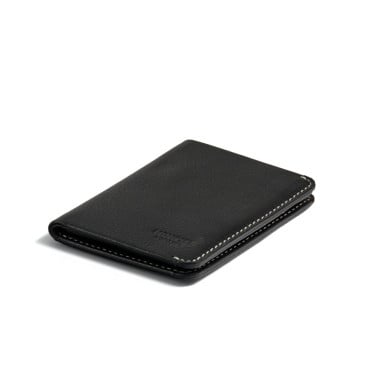 Small black leather men’s wallet with bill compartment, front view on white background - MONPIEL 2