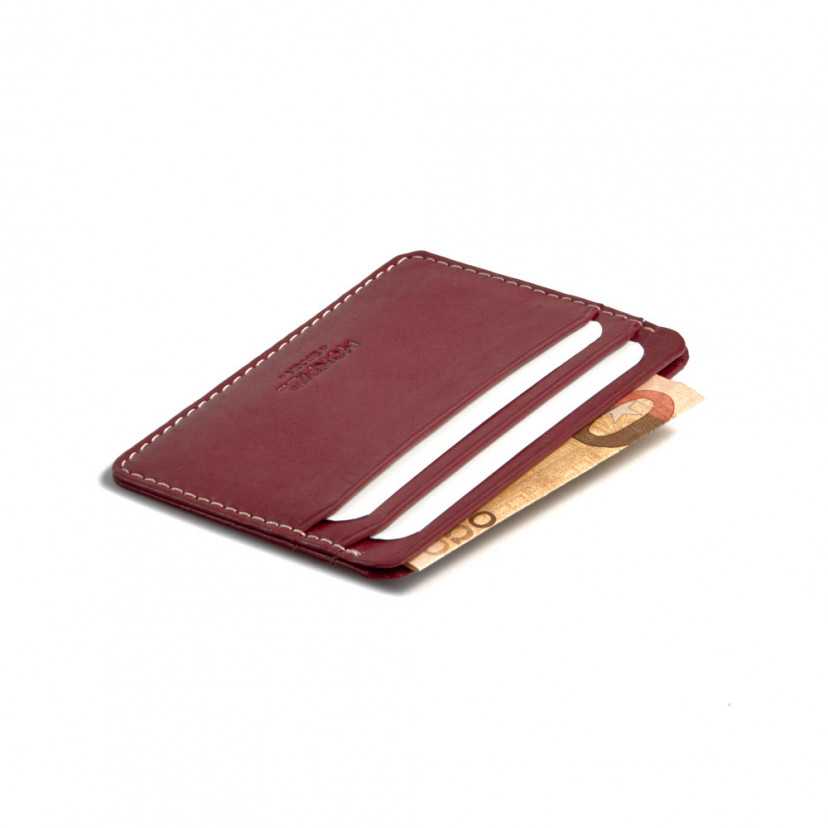 Mini leather cardholder in burgundy,perspective view with slot detail on a white background - MONPIEL