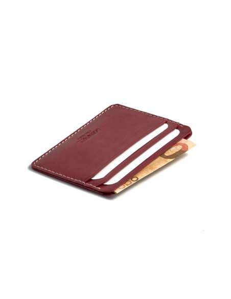 Mini burgundy leather cardholder, perspective view showing card slots, on white background - MONPIEL Mini burgundy leather cardholder, perspective view showing card slots, on white background - MONPIEL