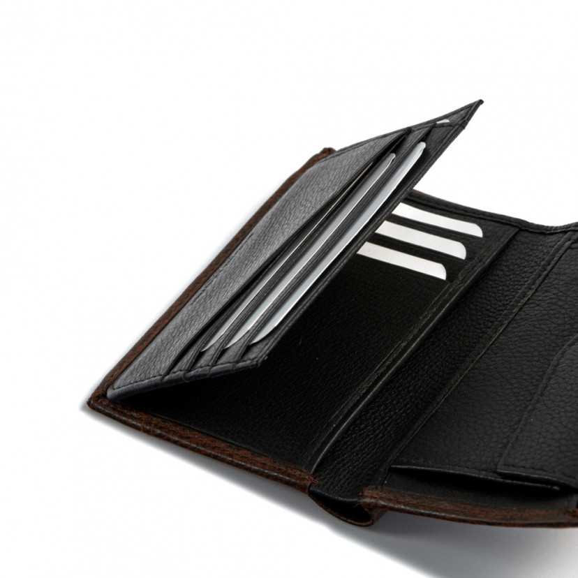 Brown leather wallet with clasp and interior coin pocket, slot detail on white background - MONPIEL