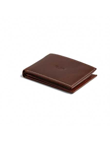 Small simple leather wallet in tan, shown in perspective on a white background - MONPIEL Small simple leather wallet in tan, shown in perspective on a white background - MONPIEL