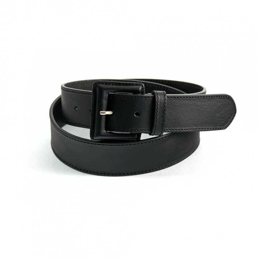 Wide women's leather belt with covered buckle in black, coiled on a white background - MONPIEL
