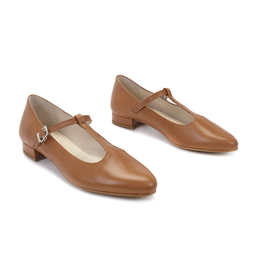 Women's Marieta leather Mary Janes in tan, shown in perspective on a white background - MONPIEL