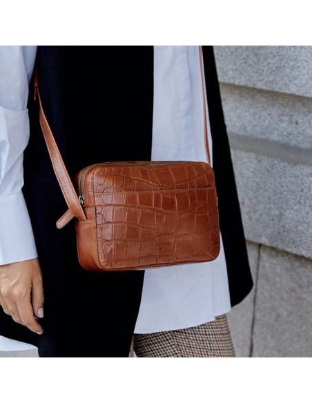 Coco leather crossbody bag in brown, with crossbody handle and perspective view, exterior background - MONPIEL