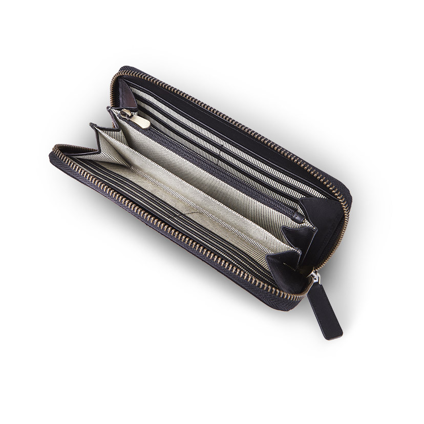 Women's leather wallet in black, with the zipper open, interior detail on a white background - MONPIEL