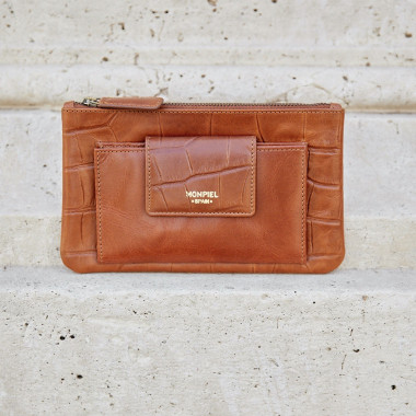 Women’s leather wallet with interior pocket in leather color, top-down perspective resting on a wooden table - MONPIEL 2
