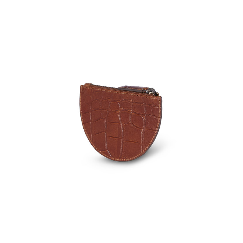 Half-moon leather coin purse in tan, shown from the back in perspective on a white background - MONPIEL