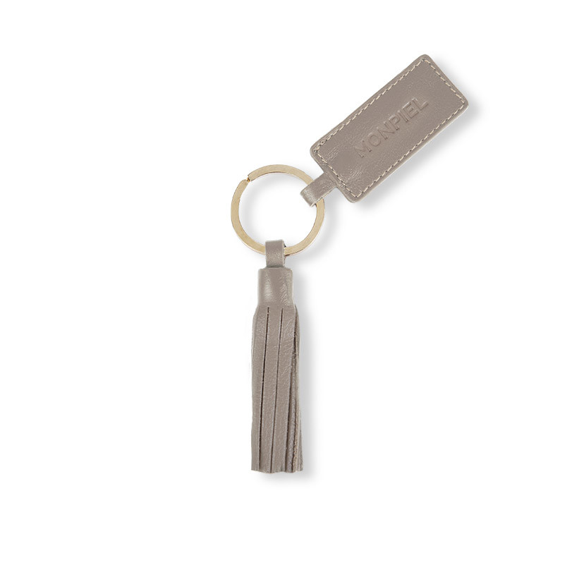 Leather tassel keychain in taupe, shown from the front on a white background - MONPIEL