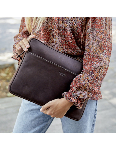 Leather laptop sleeve for 15" inches in brown held by hand with outer background - MONPIEL
