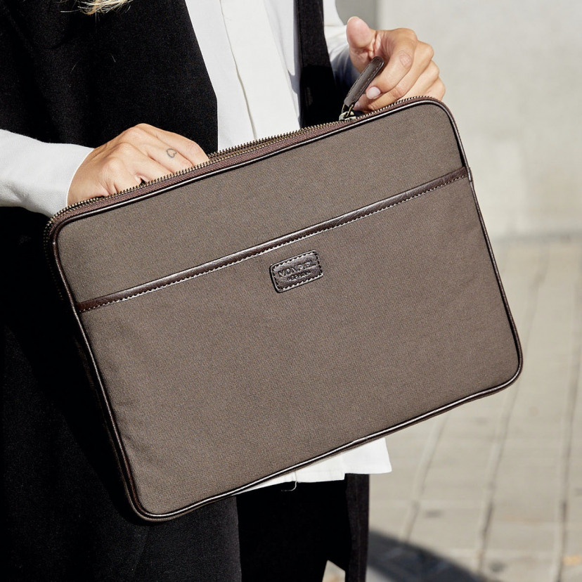 13" and 14"-inch green leather sport laptop sleeve, shown with the zipper open on an outdoor background - MONPIEL