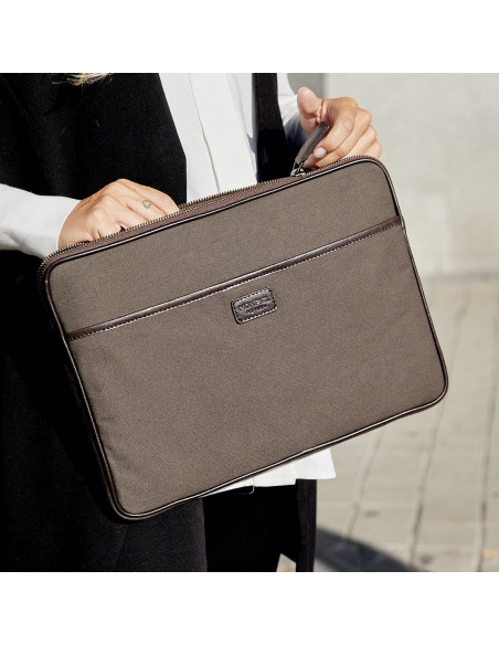 13" and 14"-inch green leather sport laptop sleeve, shown with the zipper open on an outdoor background - MONPIEL