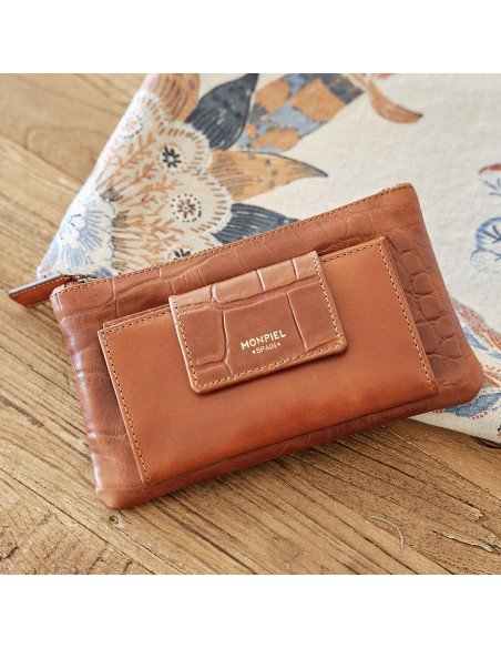 Women's leather wallet with interior bag in tan, shown from above resting on a wooden table - MONPIEL