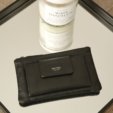 Women’s leather wallet with interior pocket in leather color, top-down perspective resting on a wooden table - MONPIEL 2