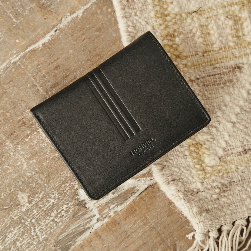 Leather wallet with clasp and coin purse in black, shown from the front and slightly tilted - MONPIEL