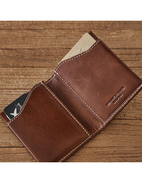 Tan leather pocket wallet, open on a wooden table - MONPIEL Tan leather pocket wallet, open on a wooden table - MONPIEL