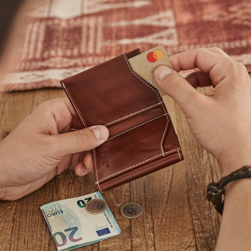 Leather pocket wallet with coin purse in tan, shown with a card being inserted into the slot - MONPIEL