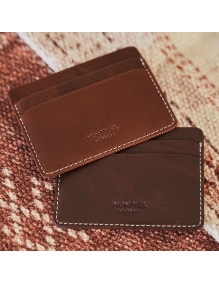 Mini brown and Havana leather cardholders, resting on a carpet with a front view - MONPIEL Mini brown and Havana leather cardholders, resting on a carpet with a front view - MONPIEL