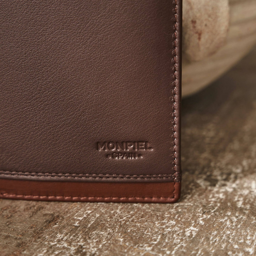 Brown leather American wallet with coin purse and cardholder, focusing on logo detail - MONPIEL