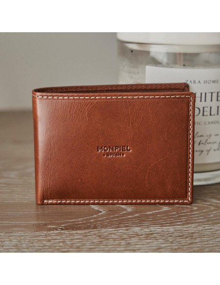 Small simple tan leather American wallet, semi-open on a wooden table with a front view - MONPIEL Small simple tan leather American wallet, semi-open on a wooden table with a front view - MONPIEL