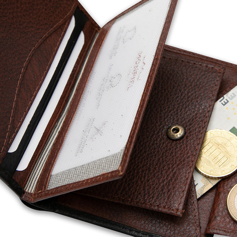 Small leather purse with coin pocket and central clasp in black with a close-up interior detail on a white background - MONPIEL