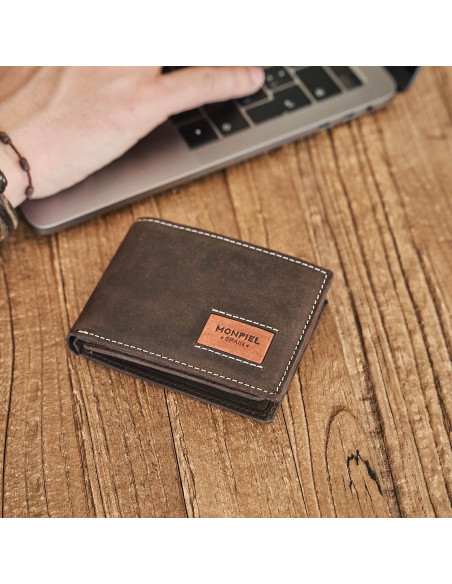 Small American leather wallet in brown, perspective view on wooden table - MONPIEL