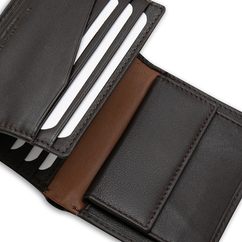 Leather wallet with lateral stripe and coin pocket in brown color, close-up interior detail, on a white background - MONPIEL
