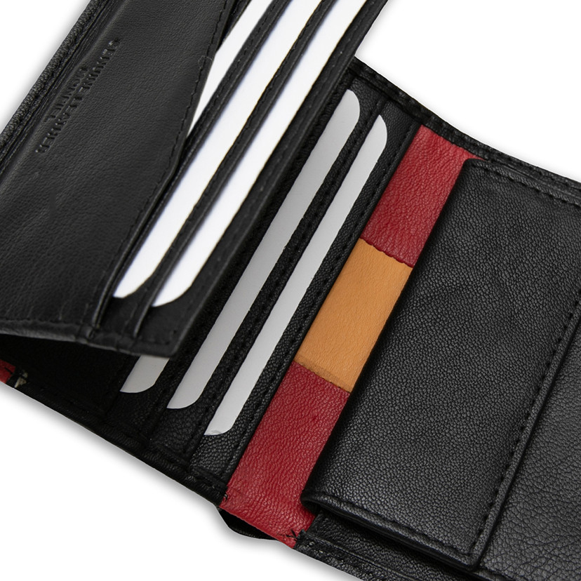 Leather purse with coin pocket, featuring Spanish flag, in black color, close-up interior detail, on a white backgroun - MONPIEL
