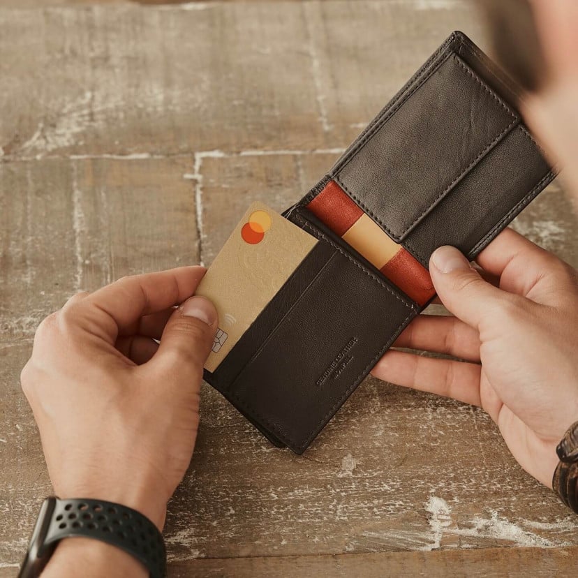 Large American-style leather wallet featuring Spanish flag, in brown color, card detail, on a wooden table - MONPIEL