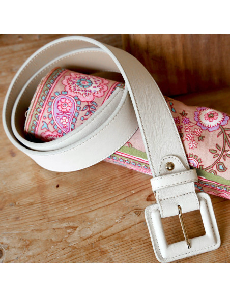 Wide leather women’s belt with covered buckle in beige, coiled on a fabric scarf - MONPIEL Wide leather women’s belt with covered buckle in beige, coiled on a fabric scarf - MONPIEL