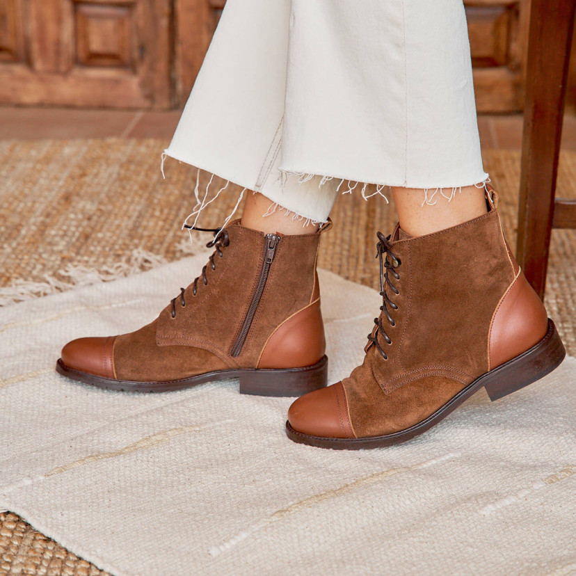 Women’s leather lace-up ankle boots in tan color, side view in motion, outdoor background - MONPIEL