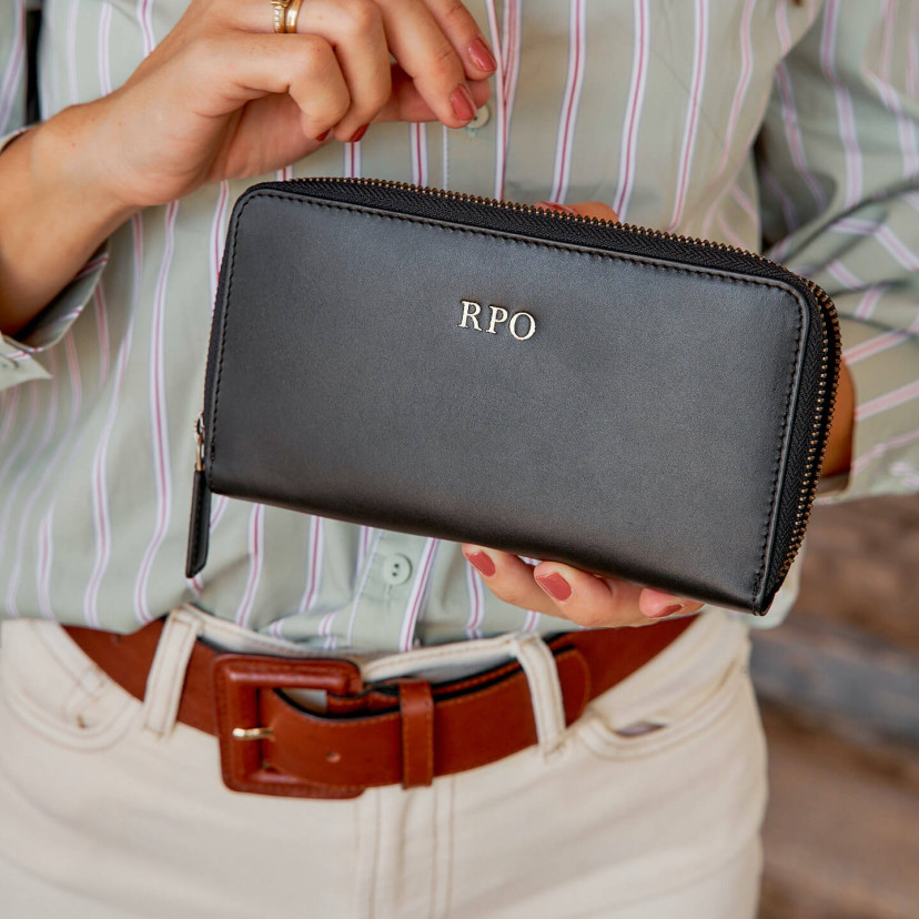 Three gold-embossed initials on a black leather wallet - MONPIEL