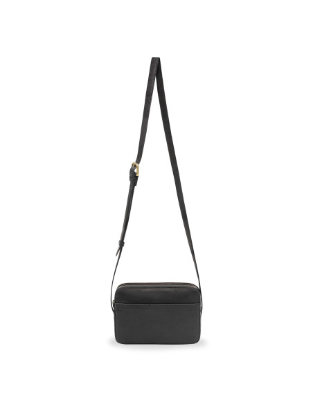 Black leather crossbody bag, front view with long strap detail on white background - MONPIEL Black leather crossbody bag, front view with long strap detail on white background - MONPIEL