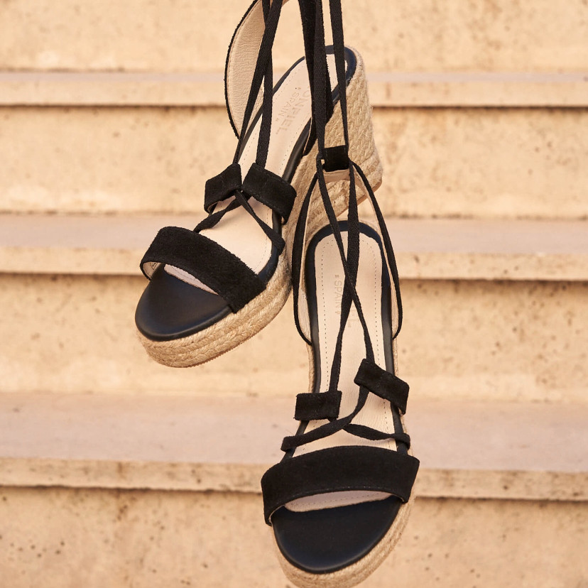 Black leather strappy wedge espadrille, hanging with outdoor background - MONPIEL