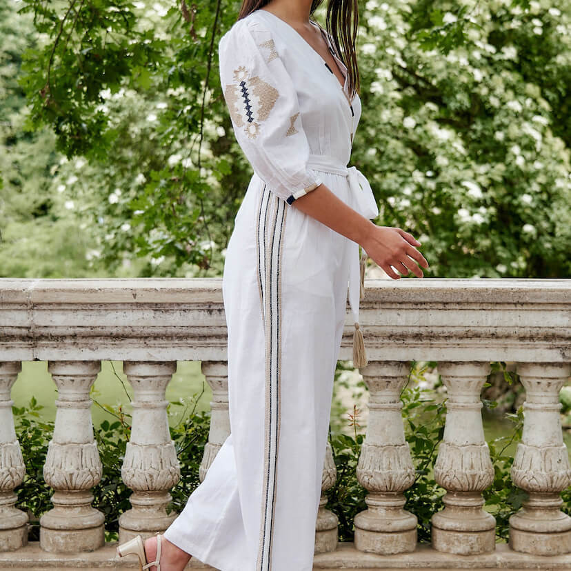 Hand-embroidered white ethnic jumpsuit, side view, embroidery details - MONPIEL