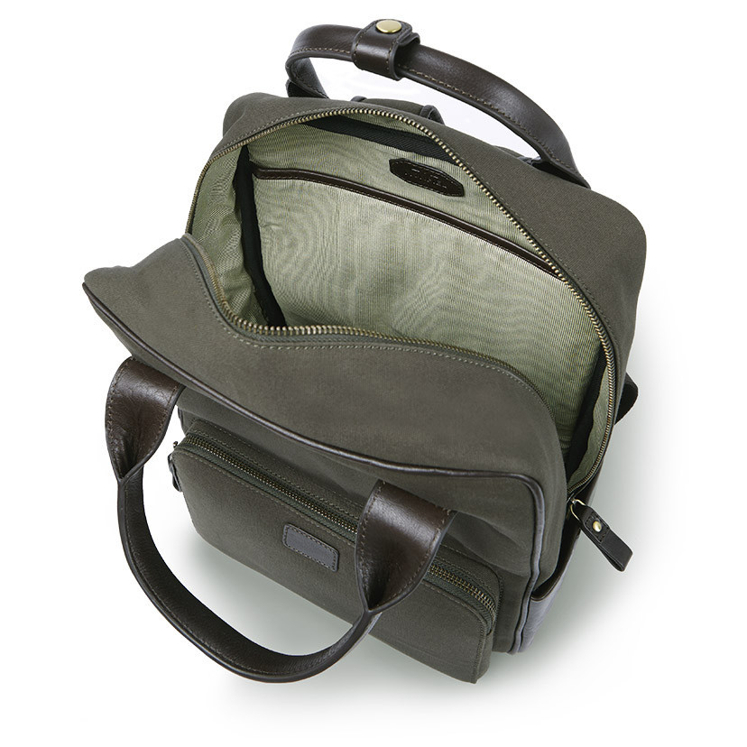 Sport canvas and leather backpack in green color, top view with open zipper, on a white background - MONPIEL