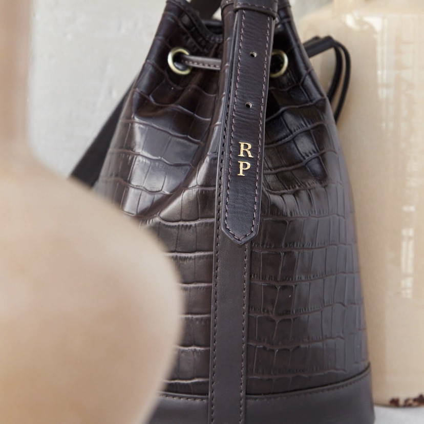 Large crocodile-patterned leather bucket bag in brown color, featuring personalization detail - MONPIEL