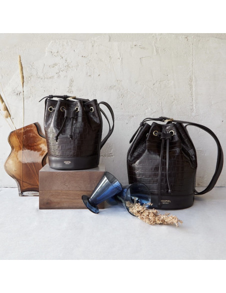 Small crocodile-patterned leather bucket bag in brown color, front view, next to a large bucket bag - MONPIEL