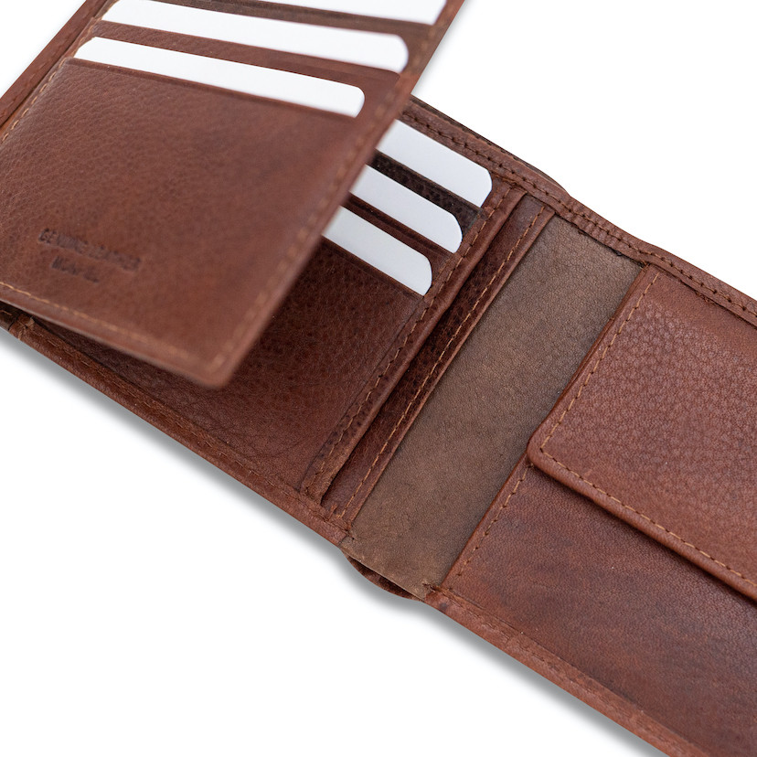 Havana leather bi-fold wallet with coin pocket and elastic band, open, card slots visible, on a white background - MONPIEL