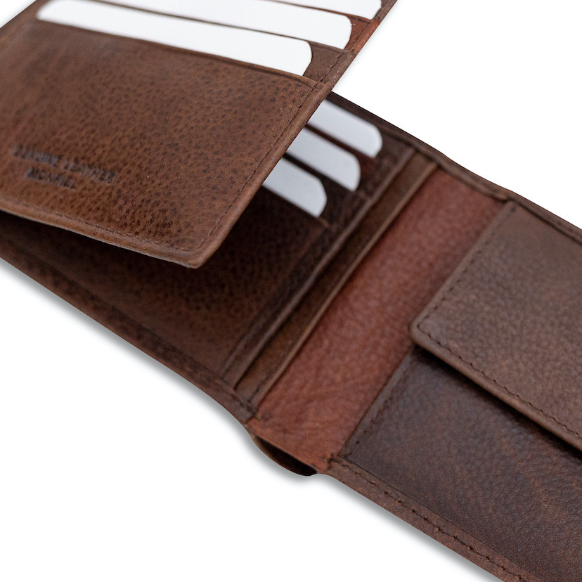 Brown leather bi-fold wallet with coin pocket and elastic band, open, showing card slots, on a white background - MONPIEL