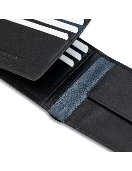 Black leather bi-fold wallet with coin pocket and elastic band, open, showing card slots, on a white background - MONPIEL Black leather bi-fold wallet with coin pocket and elastic band, open, showing card slots, on a white background - MONPIEL