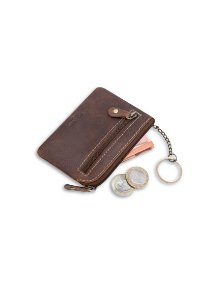 Brown leather coin purse for men, tilted with coins and a bill detail, on a white background - MONPIEL Brown leather coin purse for men, tilted with coins and a bill detail, on a white background - MONPIEL