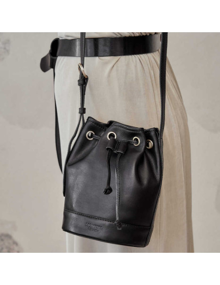 Small black leather bucket bag with front view, hanging from the shoulder - MONPIEL