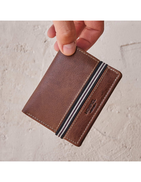 Brown leather wallet with elastic coin pocket, front view, held in hand - MONPIEL